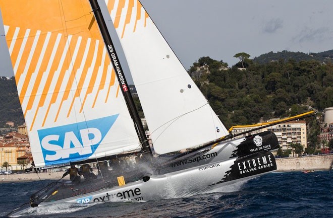 SAP Extreme Sailing Team punches through a rolling wave on the Bay of Angels. © Lloyd Images http://lloydimagesgallery.photoshelter.com/